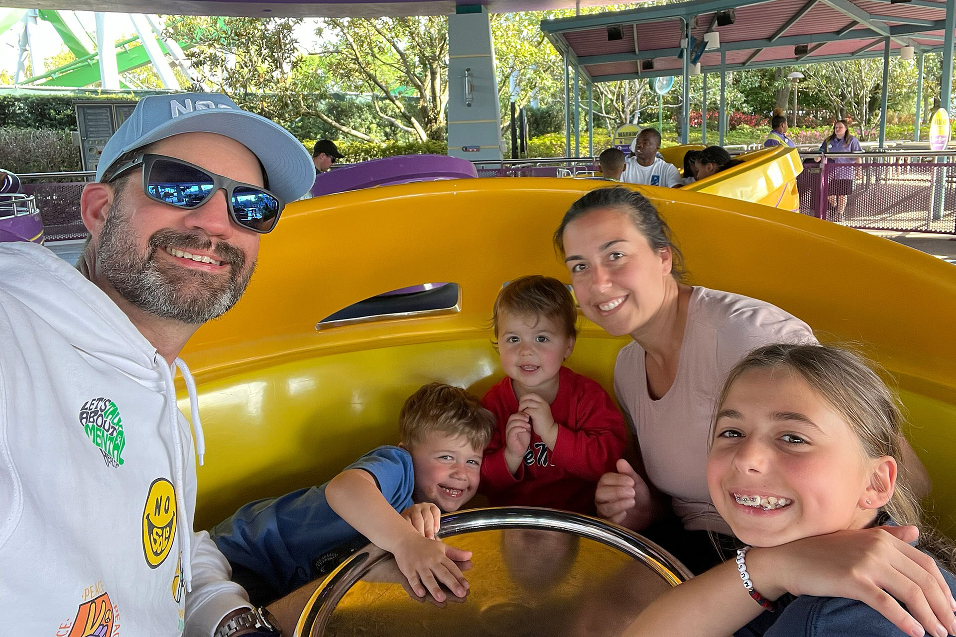 Kids smiling on a pool ladder