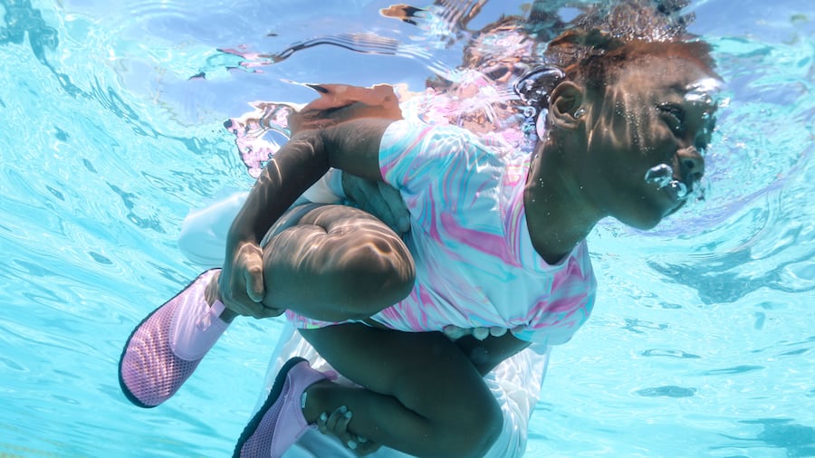 Te’Onni King, with Edison Elementary School’s Head Start program, practices blowing bubbles while participating in a beginner’s swim lesson